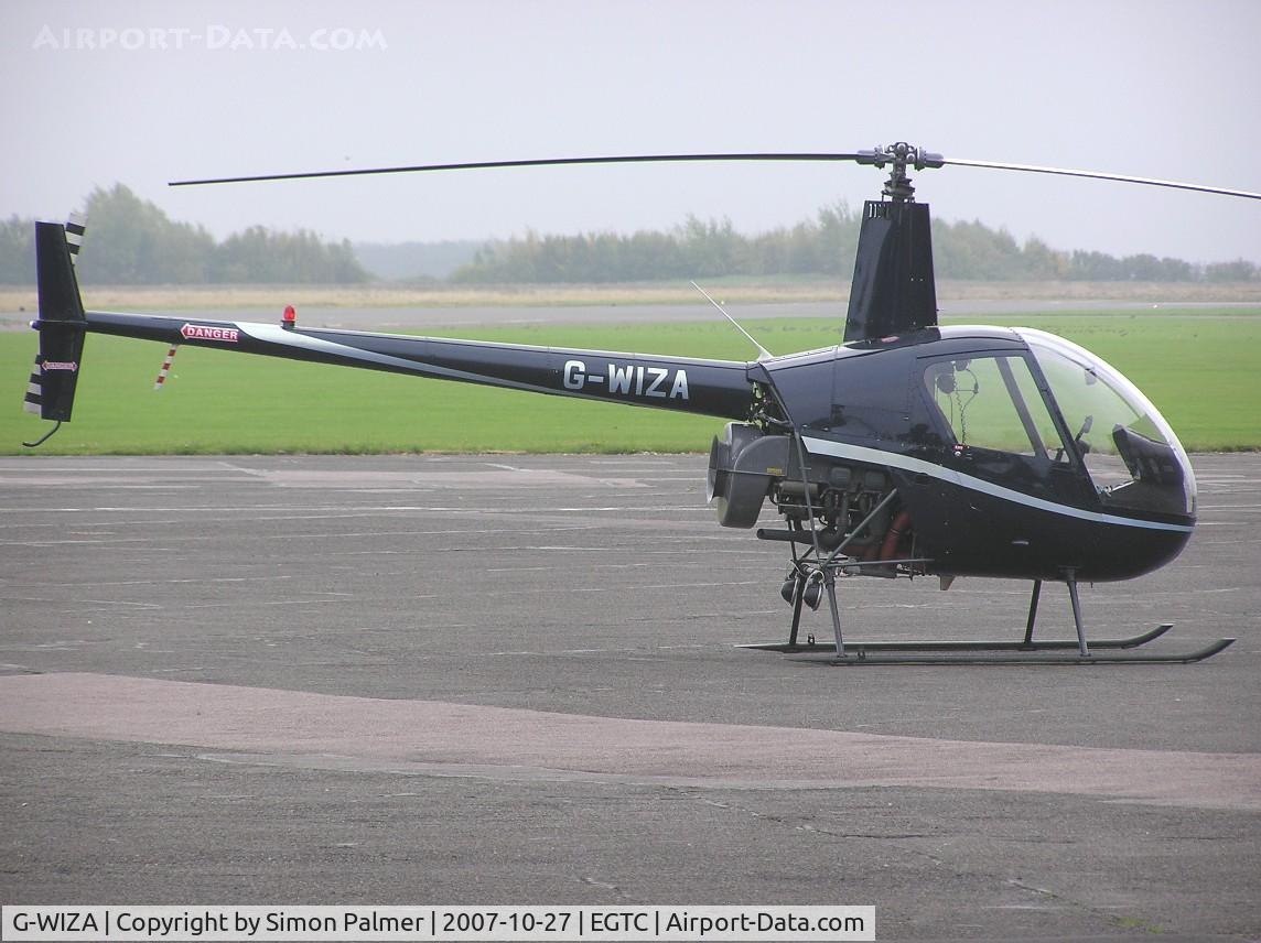 G-WIZA, 1988 Robinson R22 Beta C/N 0861, R22 on a gloomy day at Cranfield