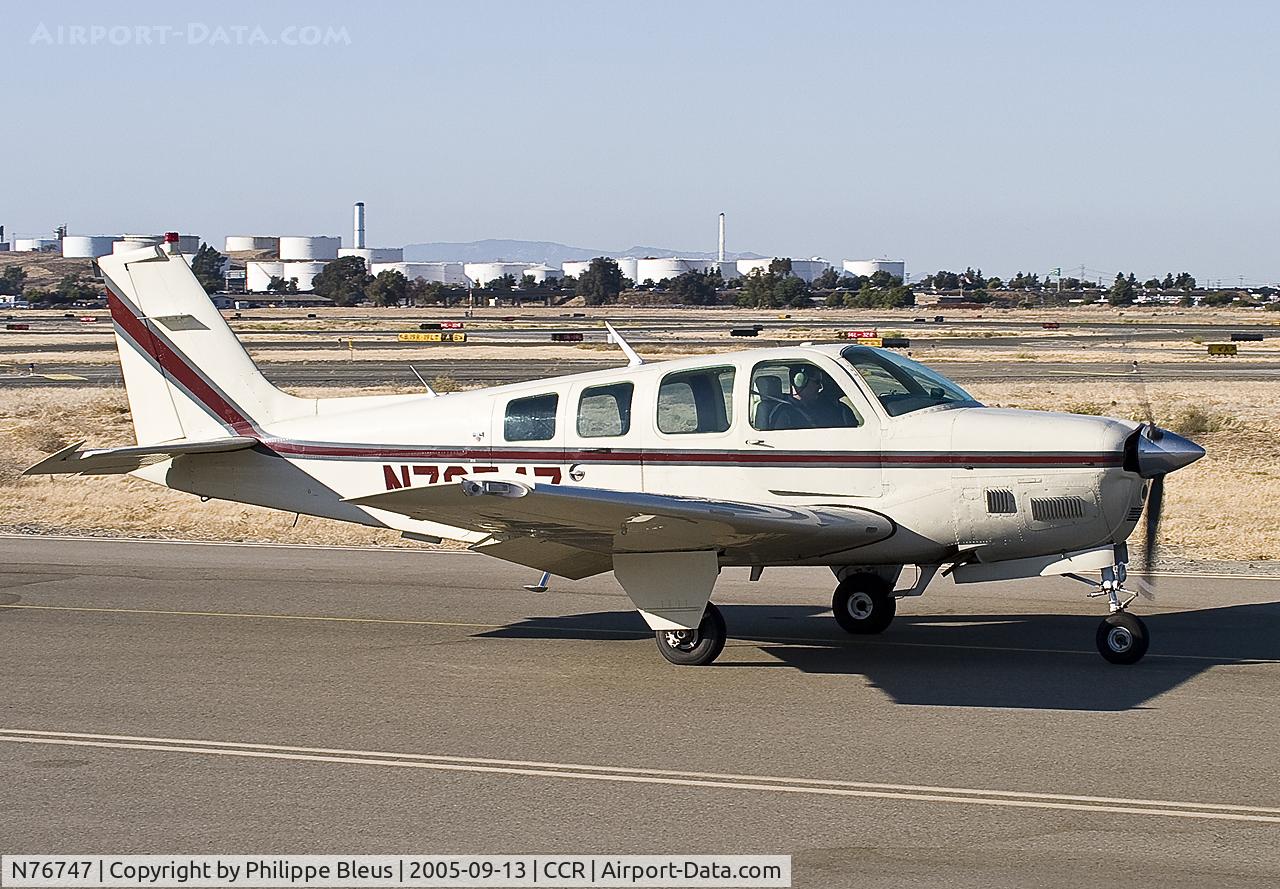 N76747, 1979 Beech A36TC Bonanza 36 C/N EA-41, taxiing alongside the observation deck.