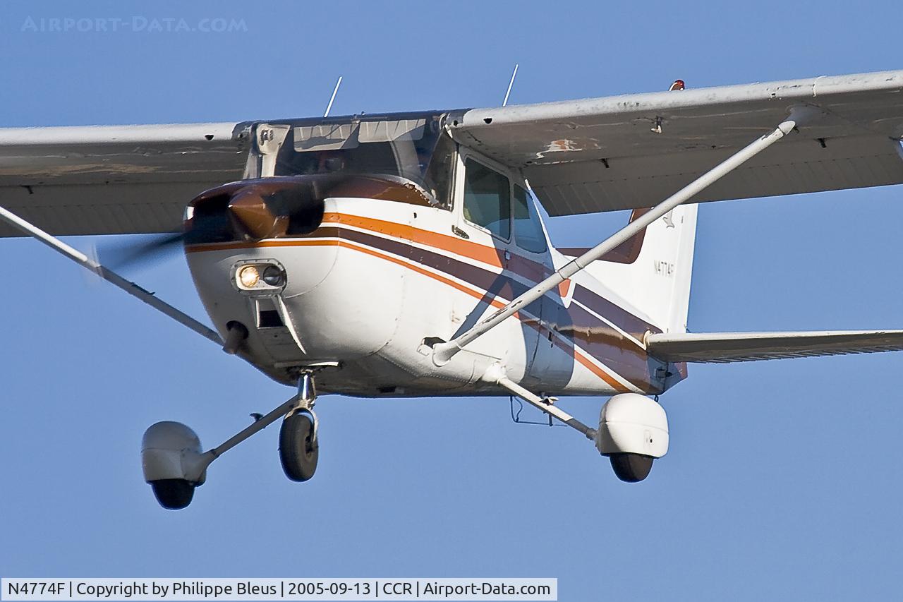 N4774F, 1979 Cessna 172N C/N 17273079, low pass rwy 32R. One of the landing lights is off.