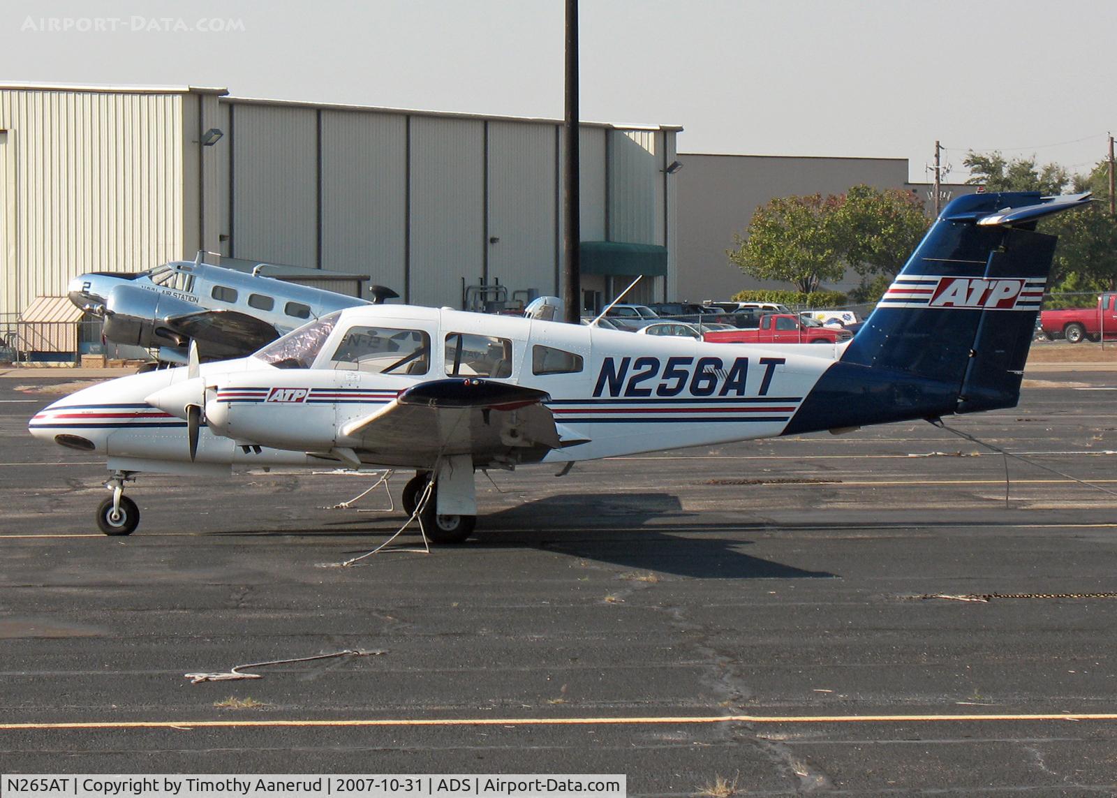 N265AT, 2001 Piper PA-44-180 Seminole C/N 4496098, Parked at Addison.  Nice Beech-18 in the background