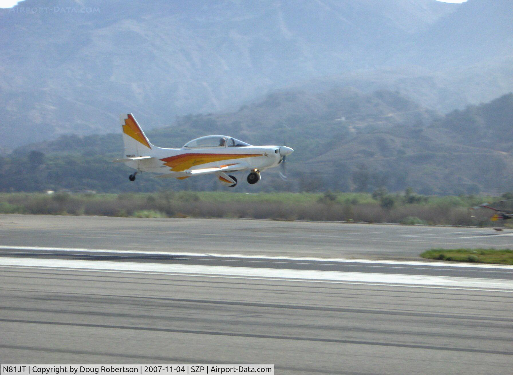 N81JT, 1982 Jurca MJ-5 Sirocco C/N 50, 1982 Tumilowicz MJ-5 SIROCCO, Lycoming A&C IO-360 220 Hp, 10 to 1 pistons, quick takeoff Rwy 22 on a still hazy morning, main gear coming up.