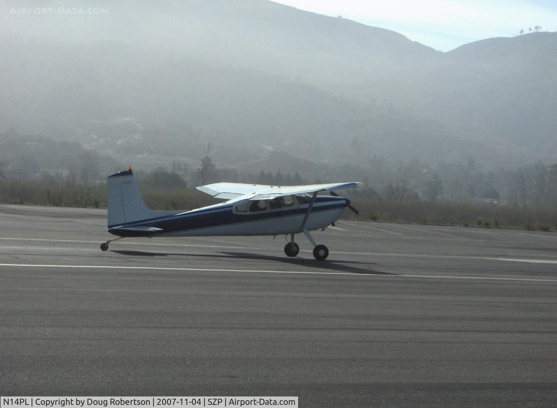 N14PL, 1966 Cessna 180H Skywagon C/N 18051711, 1966 Cessna 180H, Continental O-470 230 Hp, landing Rwy 22 in morning haze