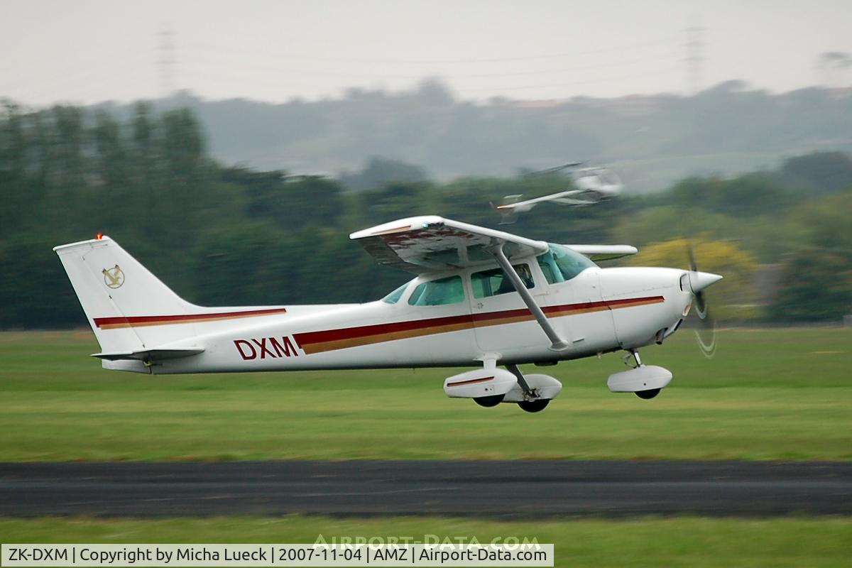 ZK-DXM, Cessna 172M C/N 17263561, Taking off - chopper in background as well...