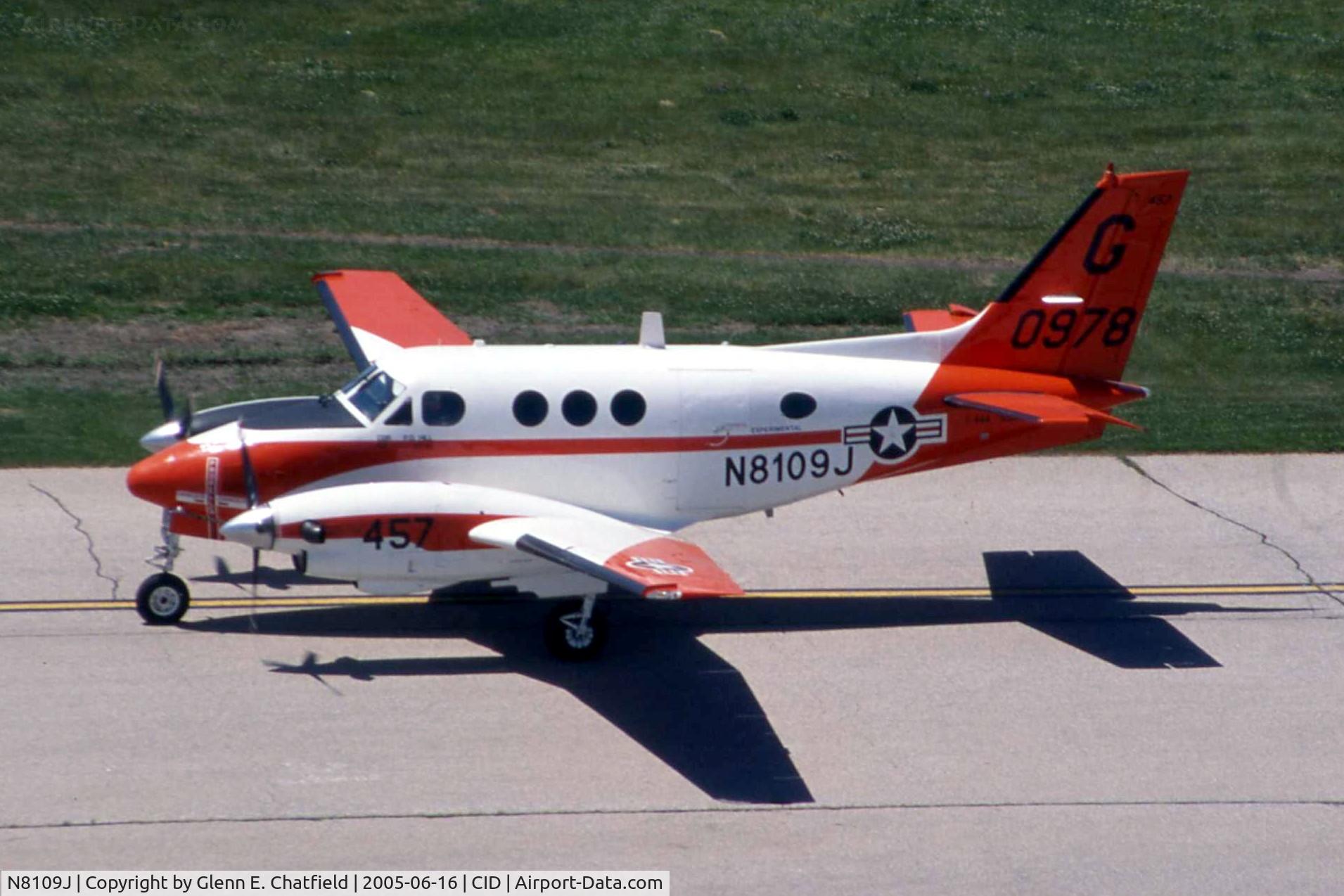 N8109J, 1978 Beech H90 (T-44A) C/N LL-30, T-44A 160978 taxiing by the control tower