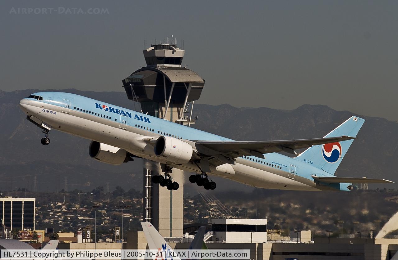 HL7531, 1997 Boeing 777-2B5/ER C/N 27946, climbing from rwy 25R in front the well known tower.