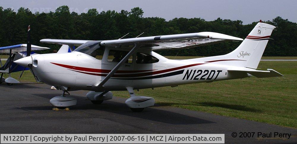 N122DT, 2000 Cessna 182S Skylane C/N 18280908, This young lady really stands out against the forest
