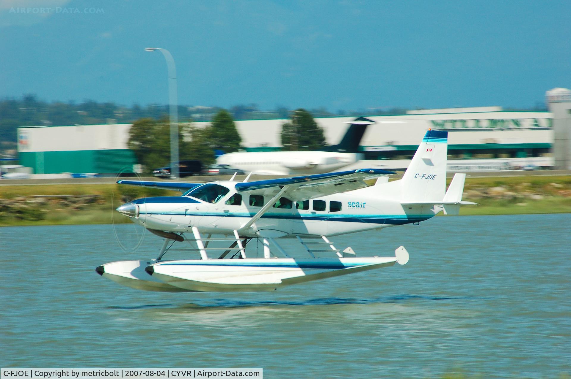 C-FJOE, 2005 Cessna 208 Caravan I C/N 20800390, about to touch down YVR seaplane terminal