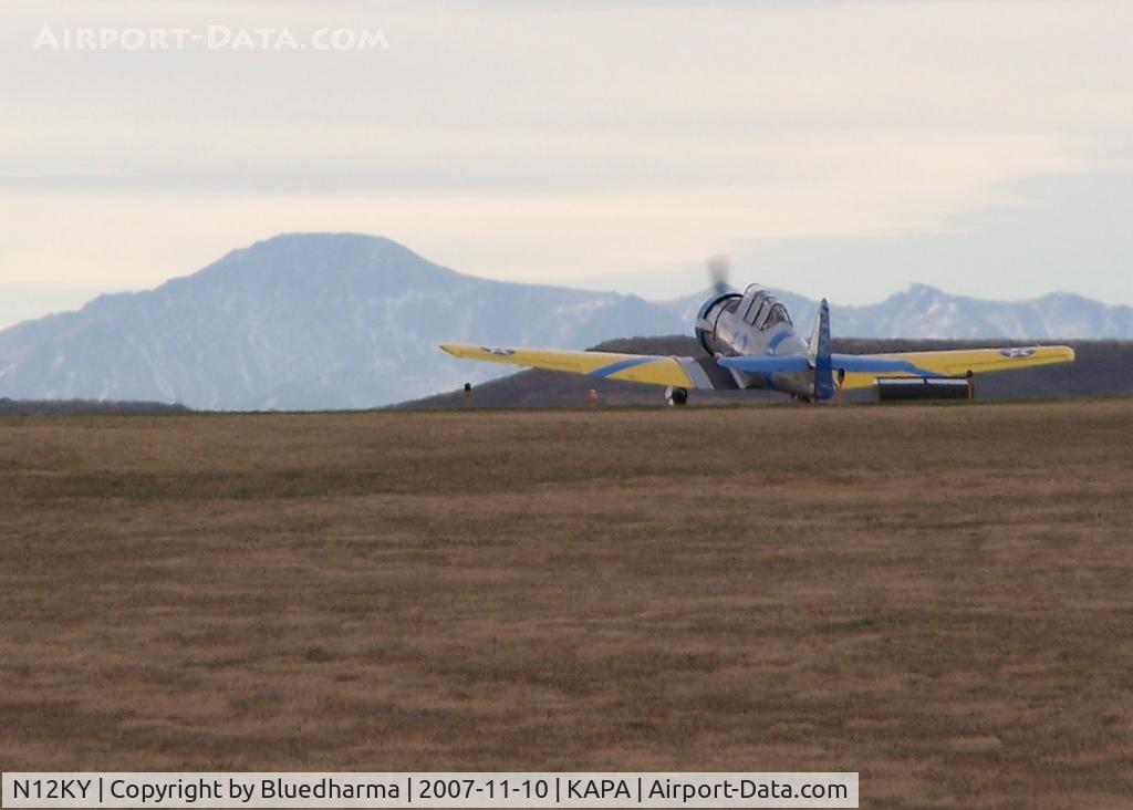 N12KY, 1943 North American SNJ-5 Texan Texan C/N 90995, The Spirit of '44 takes off with Pike's peak in the distance.
