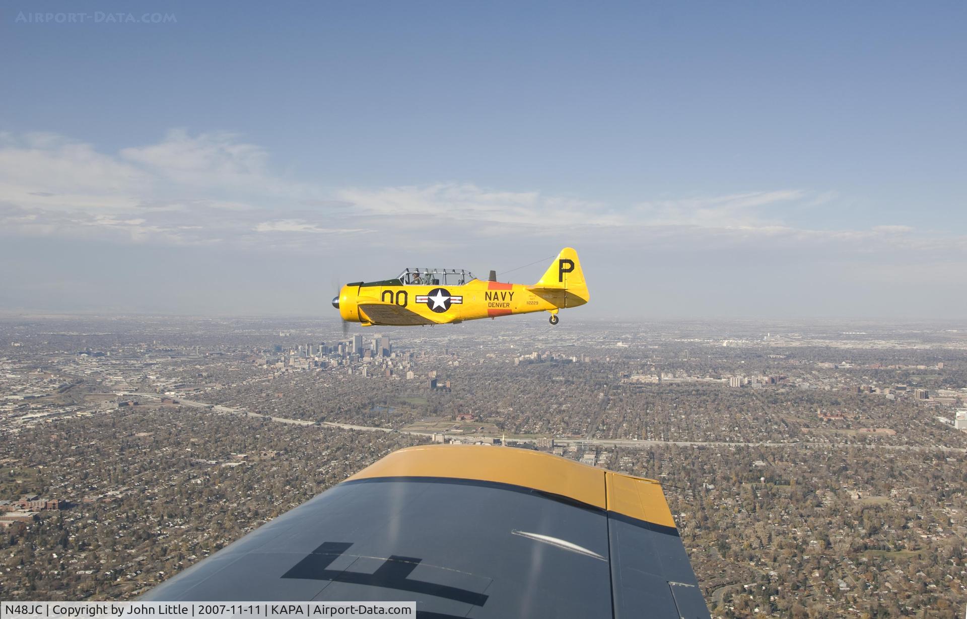 N48JC, North American AT-6G Texan Texan C/N 121-43192, Great picture of Jack, Downtown Denver and wing of Mustang