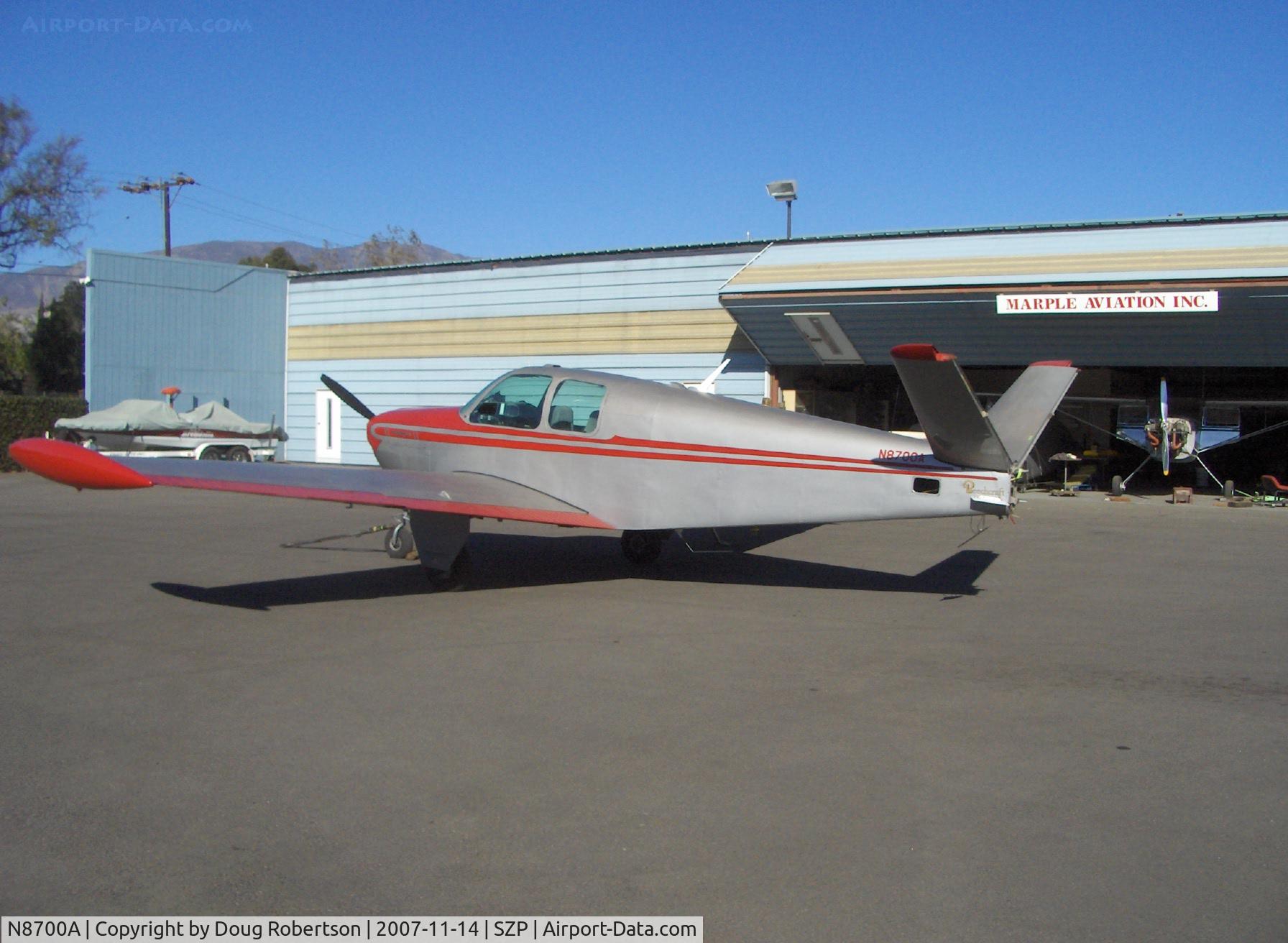 N8700A, 1949 Beech A35 Bonanza C/N D-2110, 1949 Beech A35 BONANZA, Continental E185 165/185 Hp, tip tanks, tailcone area maintenance, rudders removed. Note VOR antenna below ruddervator area