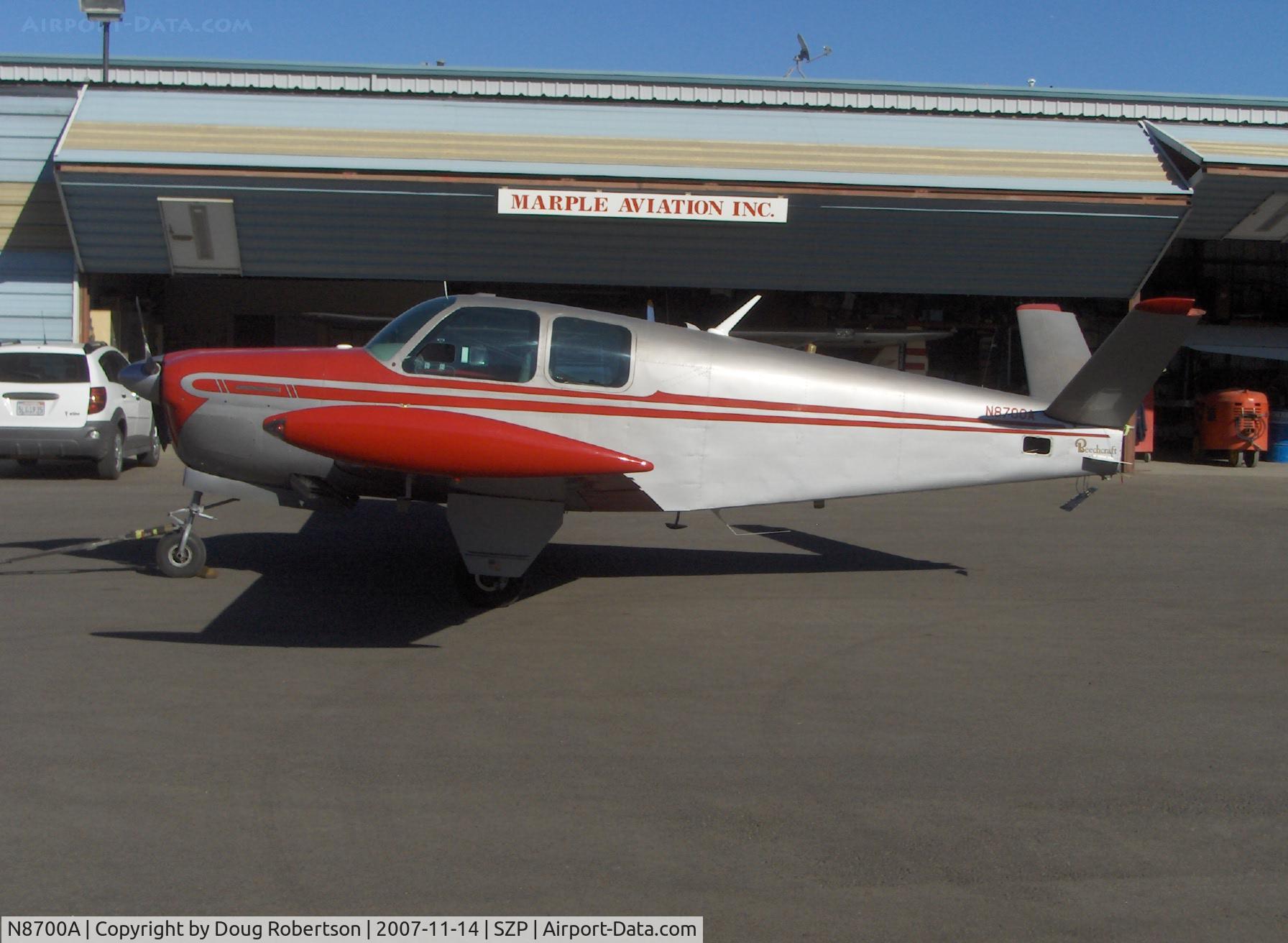 N8700A, 1949 Beech A35 Bonanza C/N D-2110, 1949 Beech A35 BONANZA, Continental E185 165/185 Hp, tip tanks, tailcone area maintenance, rudders removed. Note VOR antenna on fuselage below ruddervator area