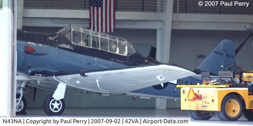 N43NA, 1943 North American SNJ-4 Texan C/N 88-11798, Ah, the glory of open hangar doors