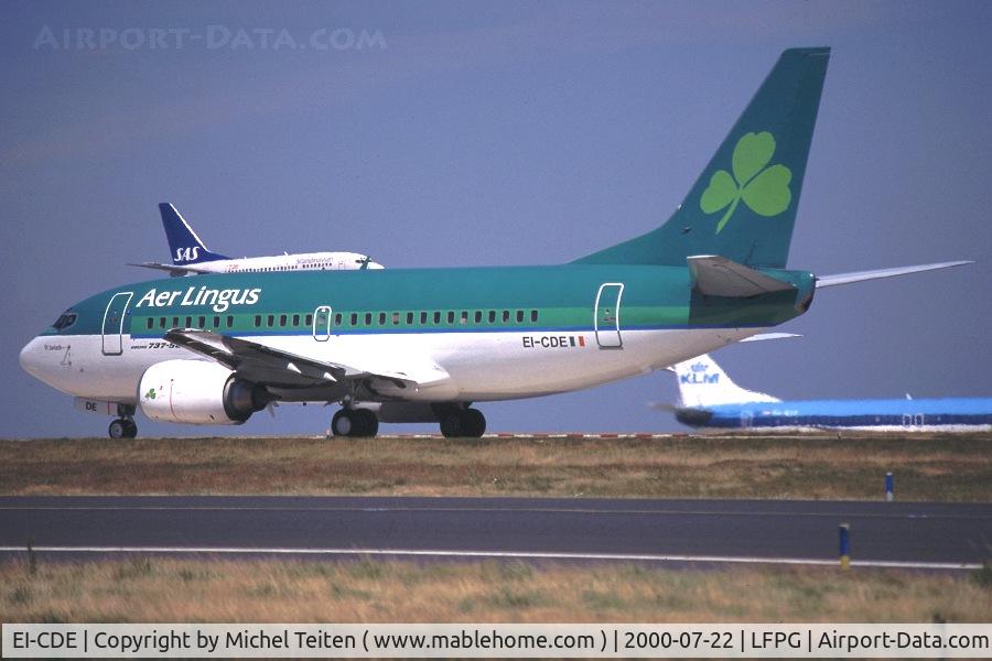 EI-CDE, 1991 Boeing 737-548 C/N 25115, Aer Lingus heading to the runway on a busy morning ( 737 from SAS landing and another one from KLM on the taxiway in the background)