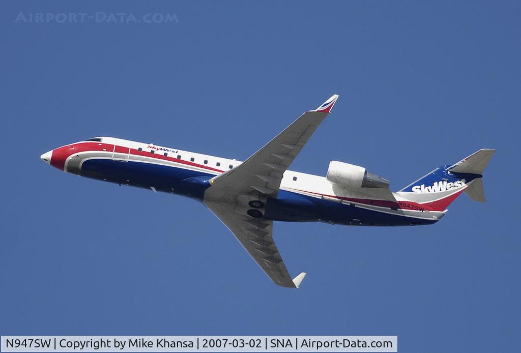 N947SW, 2003 Bombardier CRJ-200LR (CL-600-2B19) C/N 7786, Bombardier CL-600-2B19 blasting off into the blue sky.