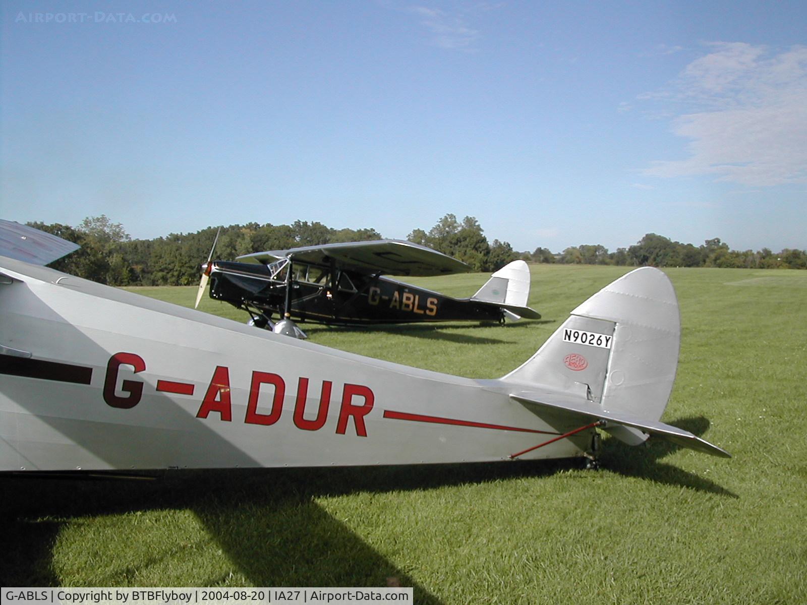 G-ABLS, 1931 De Havilland DH.80A Puss Moth C/N 2164, De Havilland Puss Moth framed by a Hornet Moth while visiting Antique Airfield near Blakesburg, IA