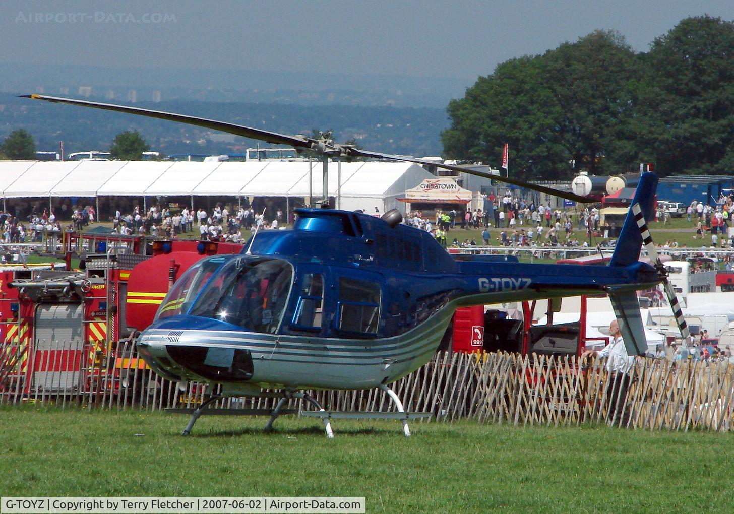 G-TOYZ, 1986 Bell 206B JetRanger III C/N 3949, Helicopters arrive at the temporary Heliport on 2007 Epsom Derby Day (Horse racing)