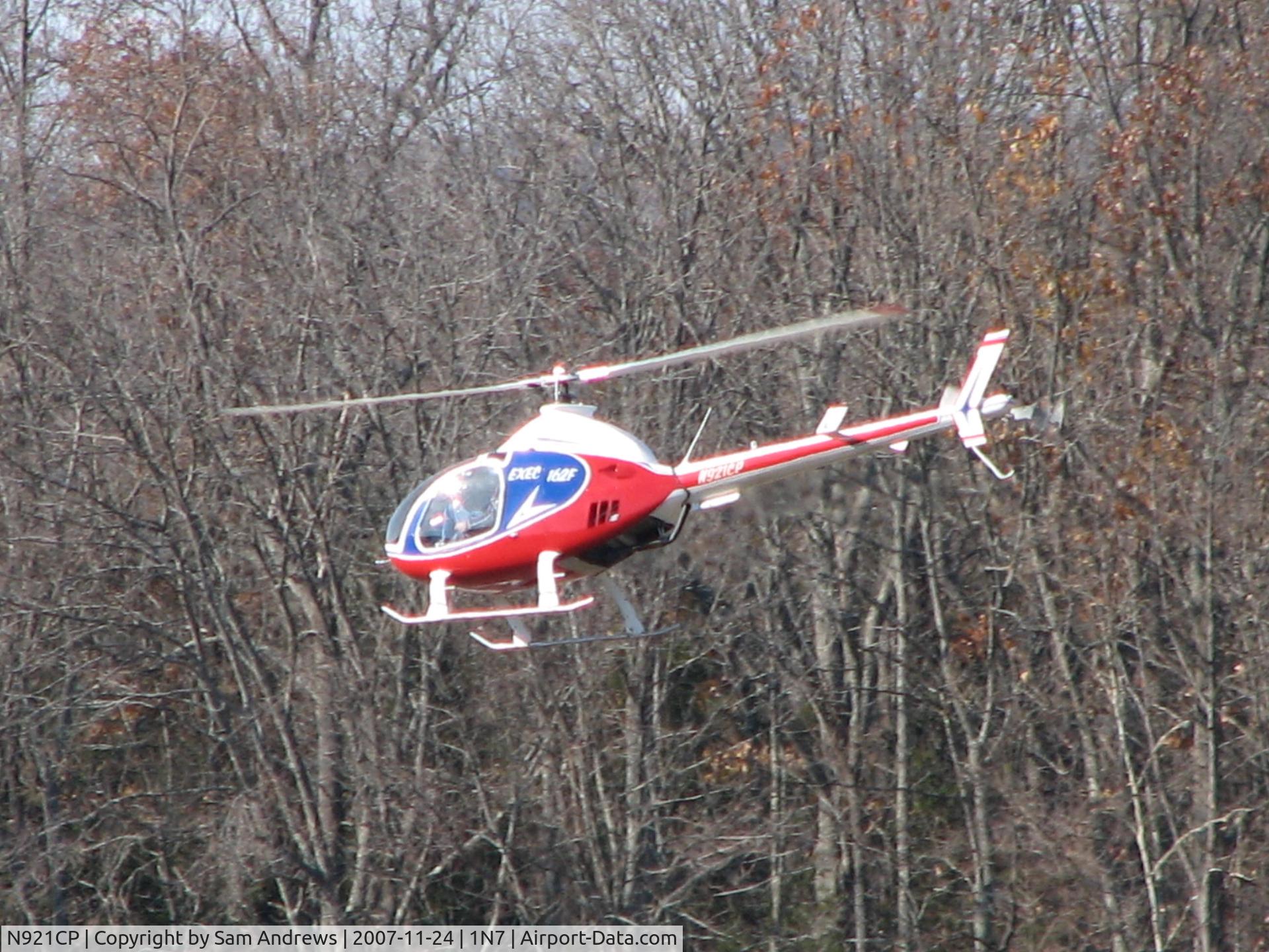 N921CP, 2002 RotorWay Exec 162F C/N 6581, I don't know where he was heading but he was doing it really fast and it took forever for him to get off the ground.