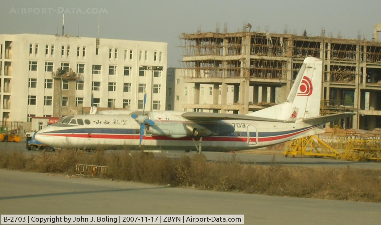 B-2703, 1986 British Aerospace BAe.146-100 C/N E1032, Y-7 (Believed to be China version of AN-26) on ramp at ZBYN/TYN