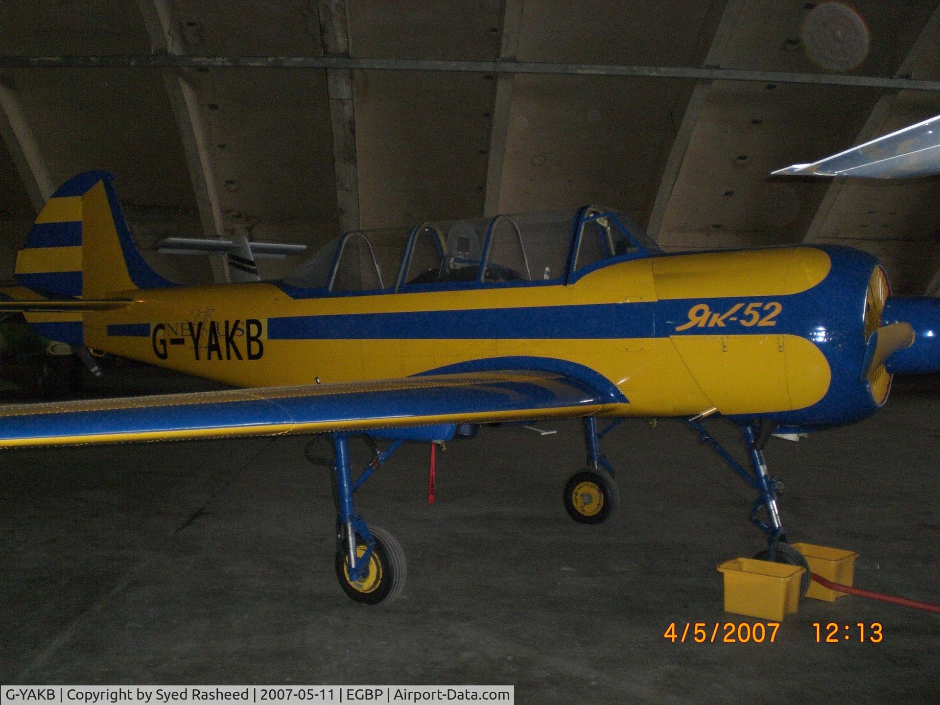 G-YAKB, 1992 Yakovlev (Aerostar) Yak-52 C/N 9211517, Parked in the Delta Jets Hanger