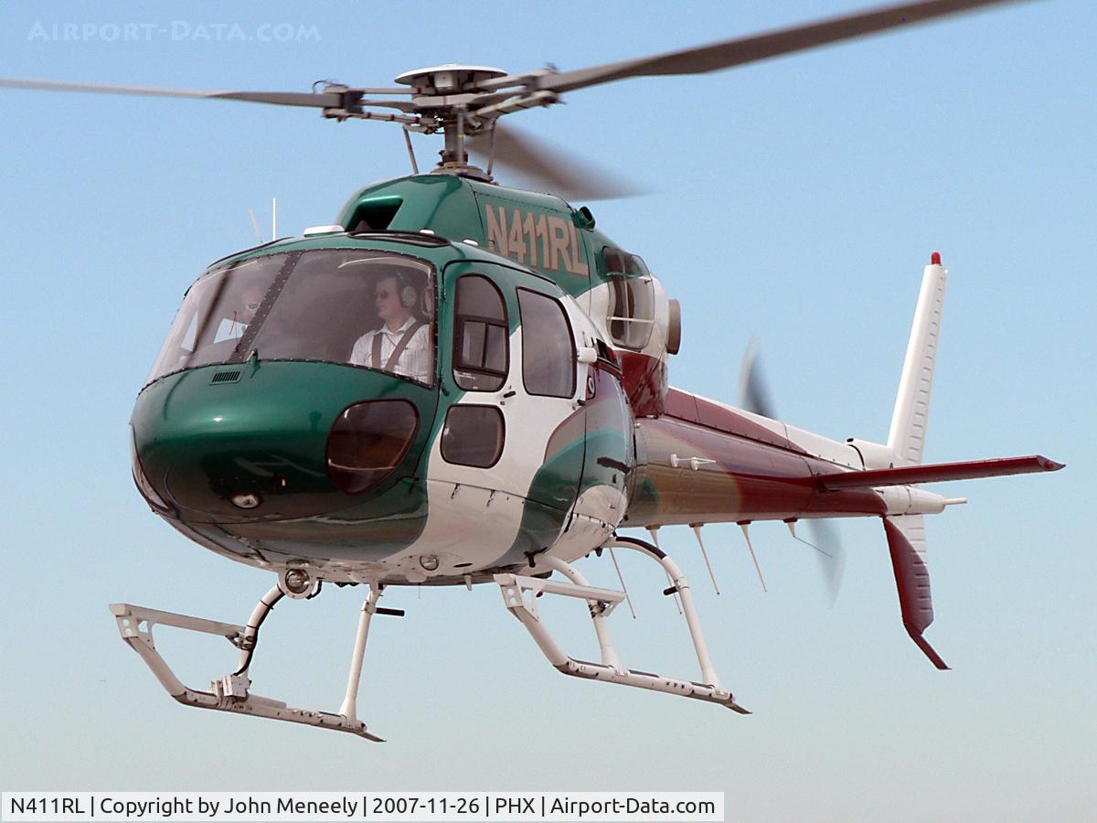 N411RL, 2002 Eurocopter AS-355N Twinstar C/N 5702, About to land on the helipad atop the Terminal 3 parking garage.