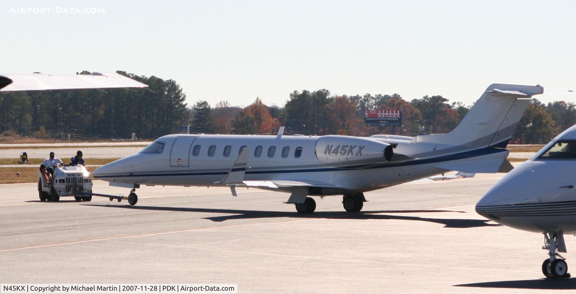 N45KX, Learjet Inc 45 C/N 233, Towing that used CarMax plane to parking.