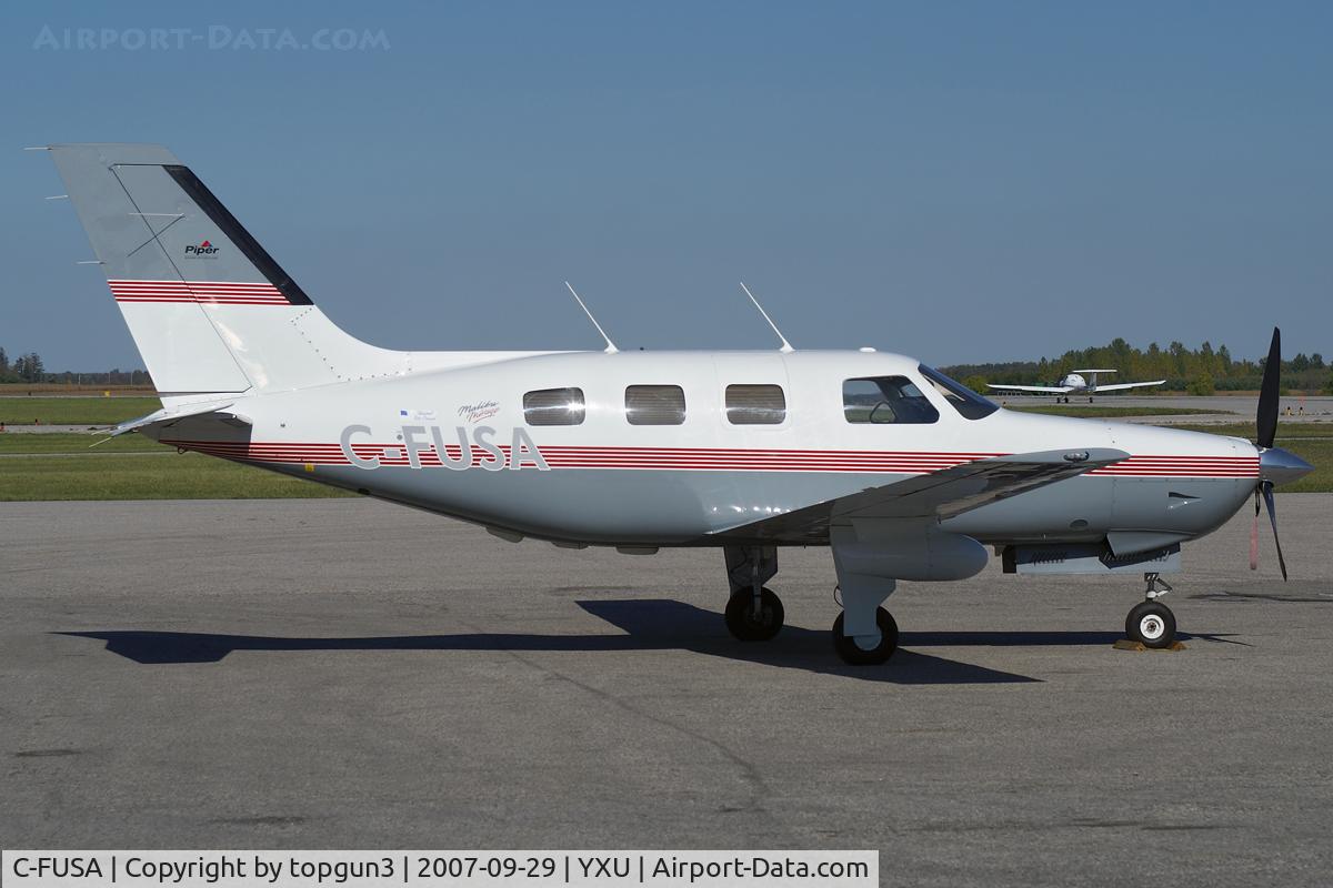 C-FUSA, 1996 Piper PA-46-350P Malibu Mirage C/N 4636040, Parked on Ramp III.