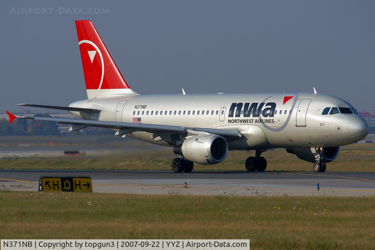 N371NB, 2003 Airbus A319-114 C/N 2095, Taxiing for departure via RWY23.