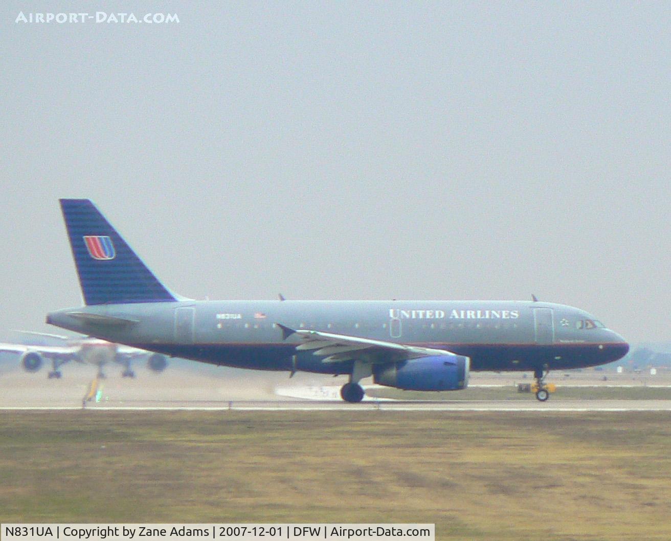 N831UA, 2000 Airbus A319-131 C/N 1291, Rainy day at DFW - Holding short 18L