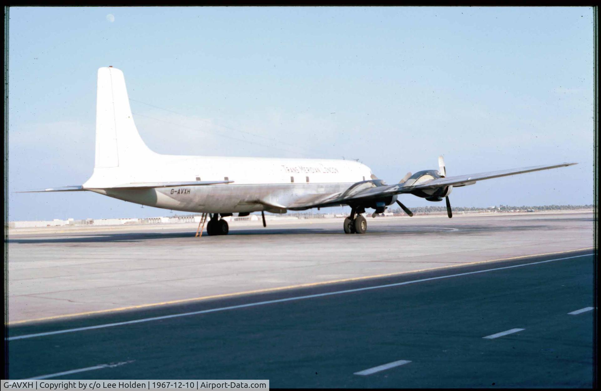 G-AVXH, Douglas DC-7CF Seven Seas C/N 44881, Seen here at Muharraq in Saudi Arabia on the 10th December 1967 in an all white scheme.