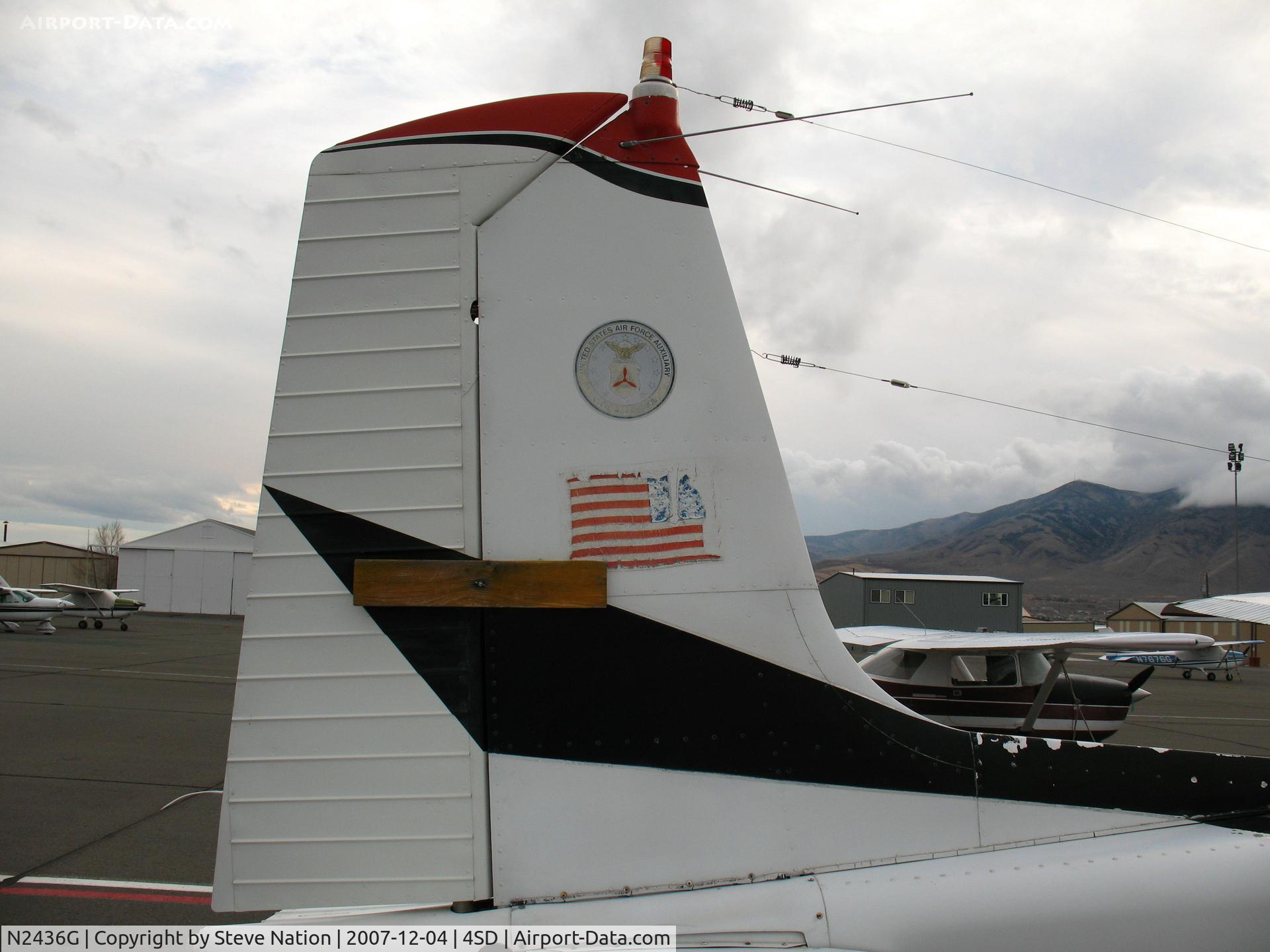 N2436G, 1959 Cessna 182B Skylane C/N 51736, close-up of faded CAP emblem on tail of 1959 Cessna 182B (no prop) @ Reno-Stead