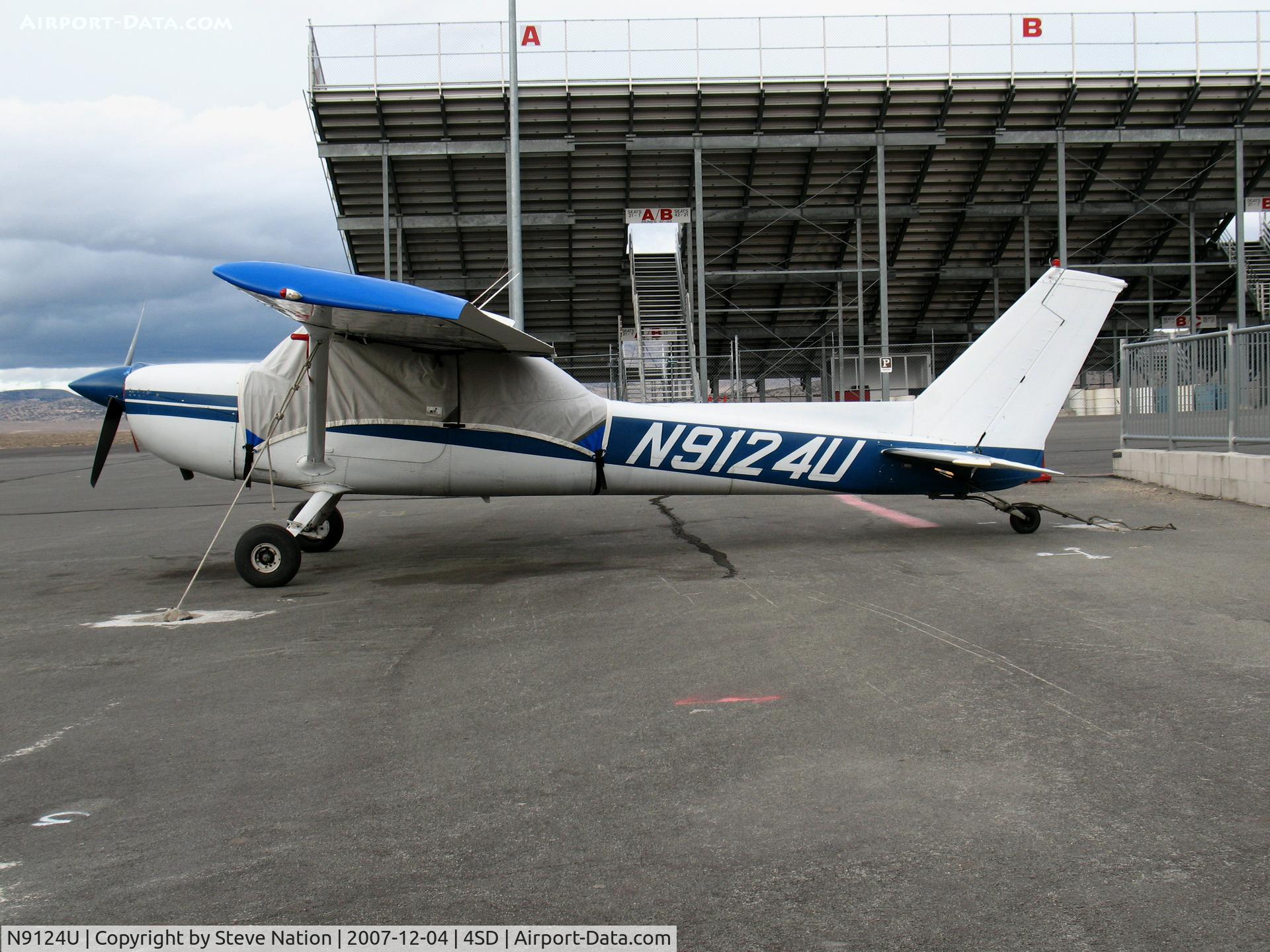 N9124U, 1976 Cessna 150M C/N 15078075, 1976 tail-dragger Cessna 150M with cover @ Reno-Stead