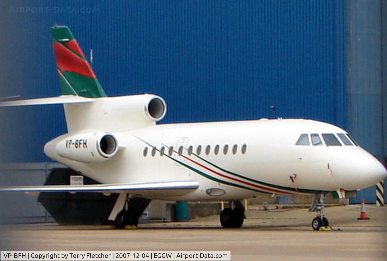 VP-BFH, 1998 Dassault Falcon 900B C/N 173, Colourful Falcon 900 parked at Luton
