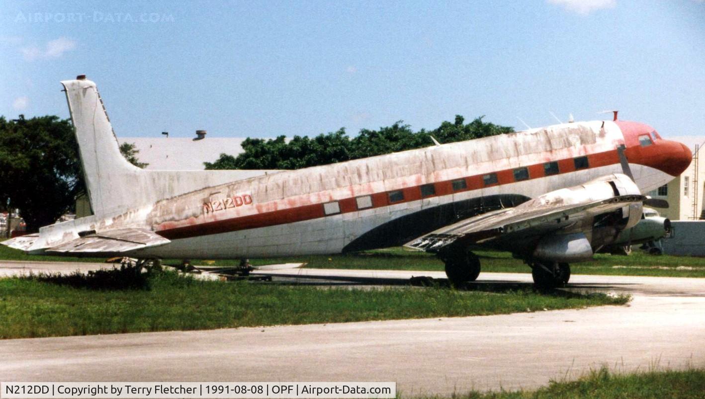 N212DD, Douglas C-117D C/N 43386, In a pretty battered colour scheme at Opa Locka in 1991