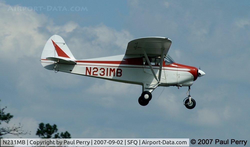 N231MB, 1961 Piper PA-22-108 Colt C/N 22-8539, Crossing over the road, headed for the piano keys on Runway 7