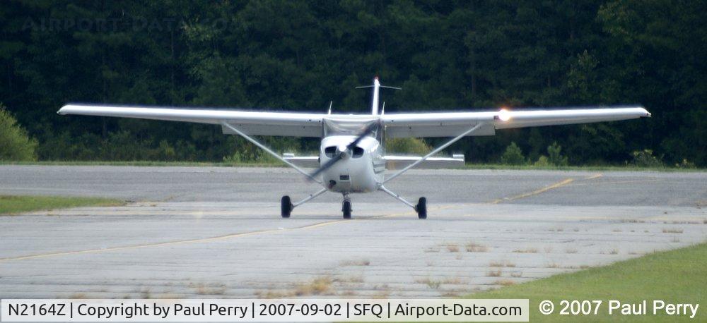 N2164Z, 2003 Cessna 172S C/N 172S9533, Taxiing in, landing light glaring away