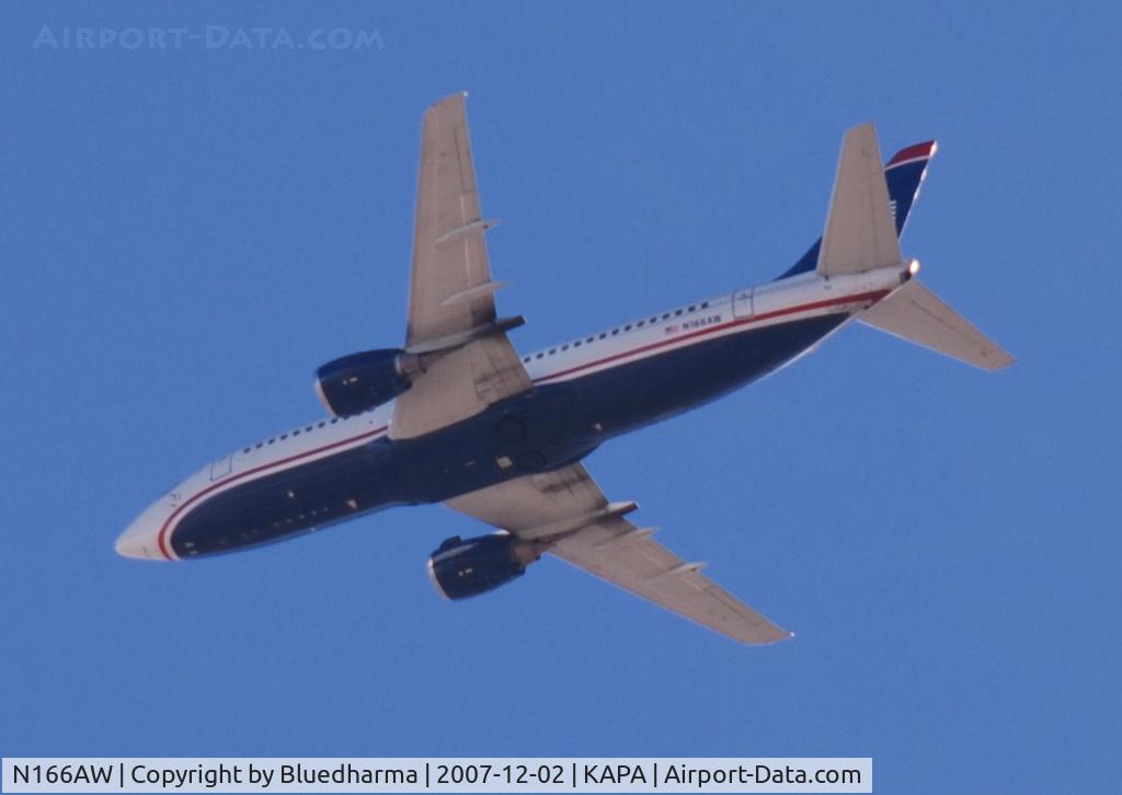 N166AW, 1986 Boeing 737-33A C/N 23627, Flew over KAPA, just low enough to get the N-number.