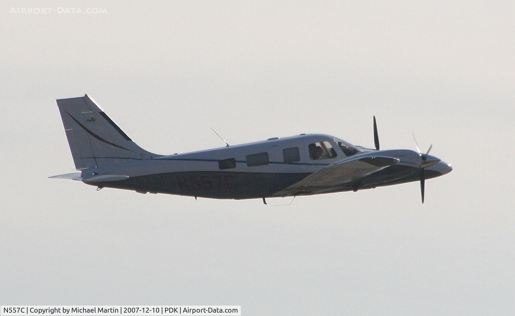 N557C, 2002 Piper PA-34-220T C/N 3449247, Long range photo - overflying PDK