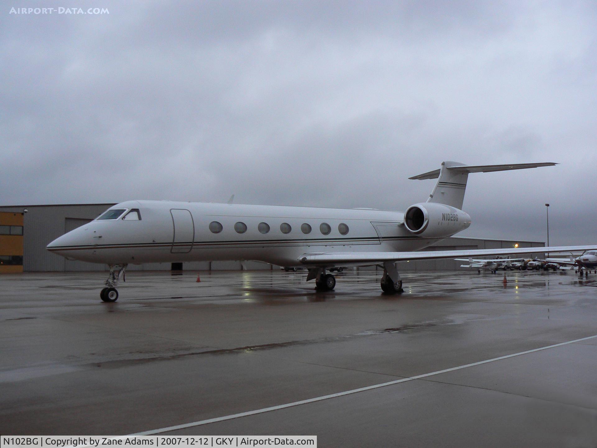 N102BG, 2004 Gulfstream Aerospace GV-SP (G550) C/N 5038, ON the ramp at Arlington Municipal...in the cold rain