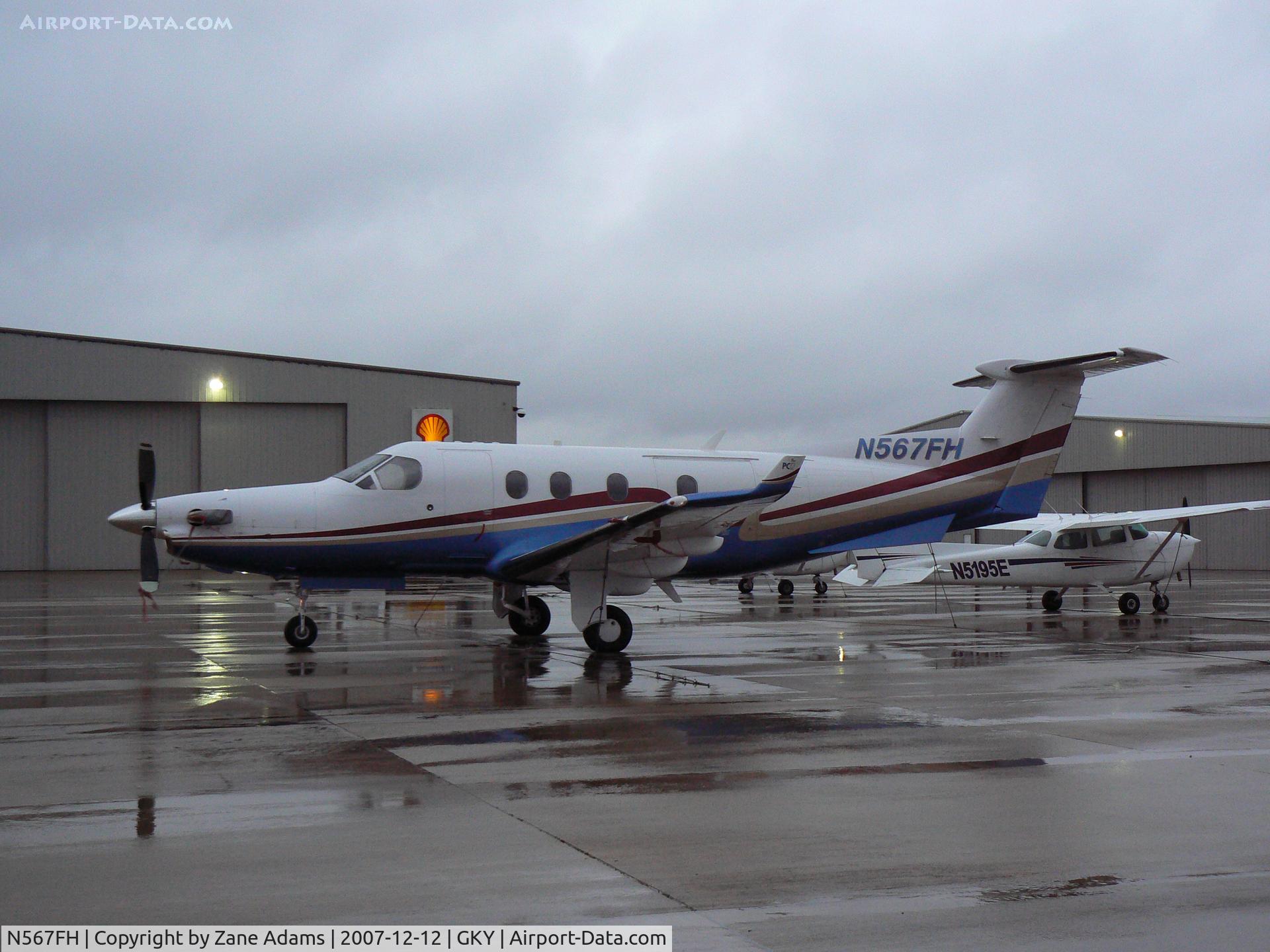 N567FH, 2004 Pilatus PC-12/45 C/N 567, On the ramp at Arlington Municipal...in the cold rain