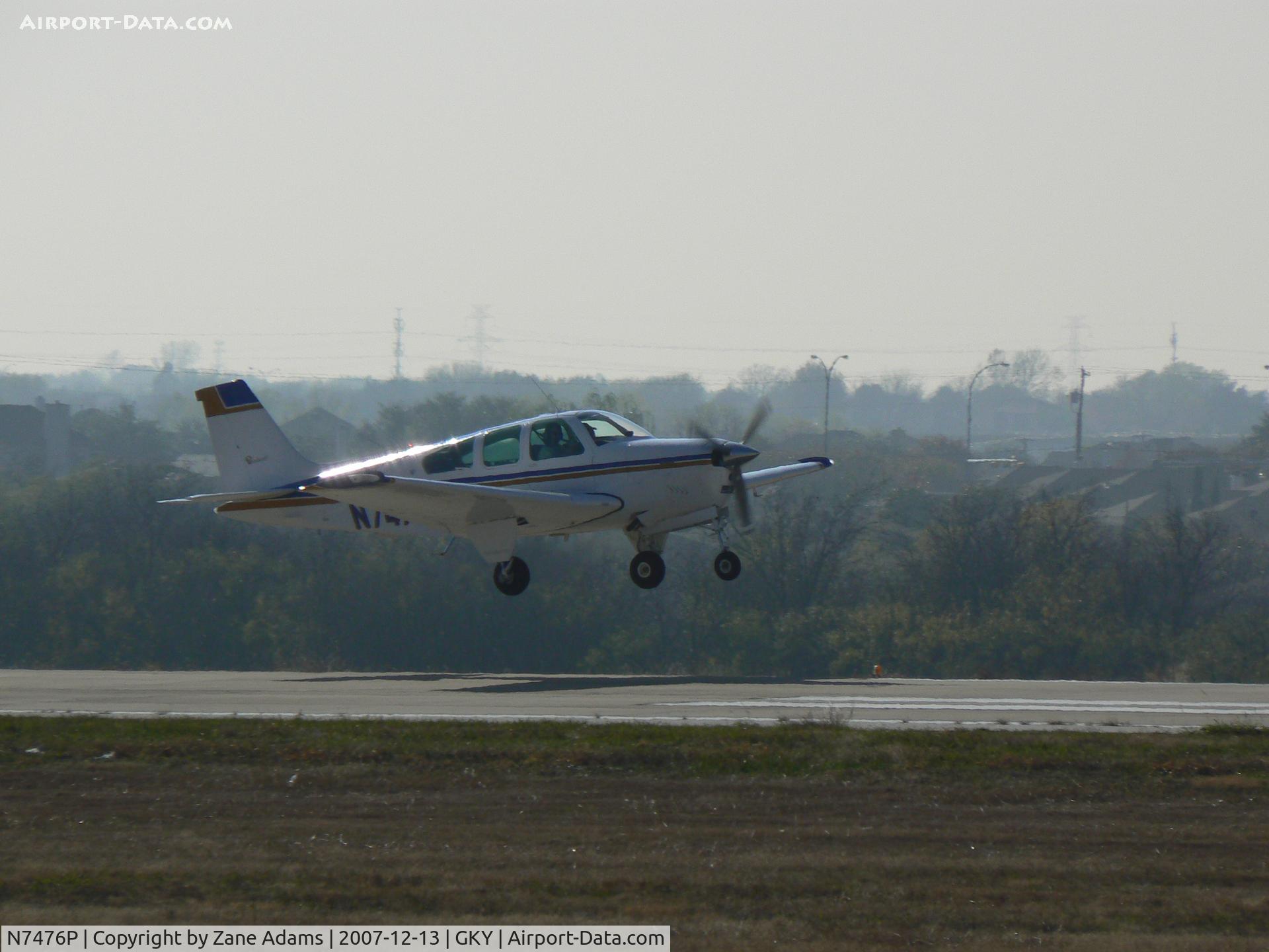 N7476P, 1976 Beech F33A Bonanza C/N CE-631, Departing Arlington Municipal