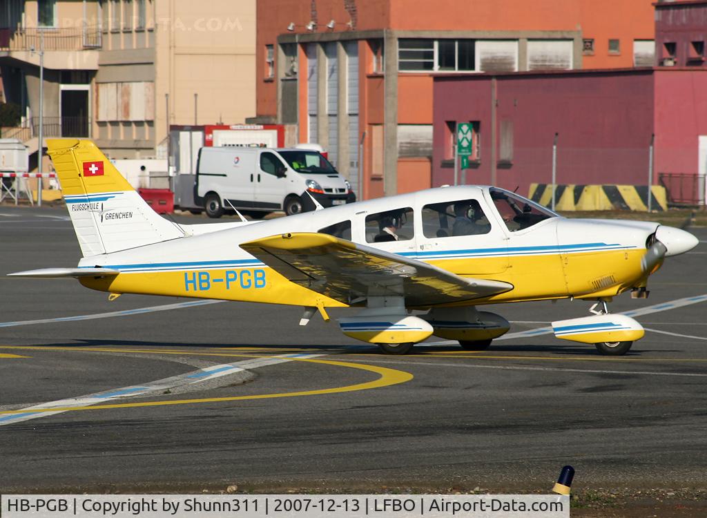 HB-PGB, 1981 Piper PA-28-181 Archer II C/N 28-8190142, Arriving from a flight and parked at the general aviation apron