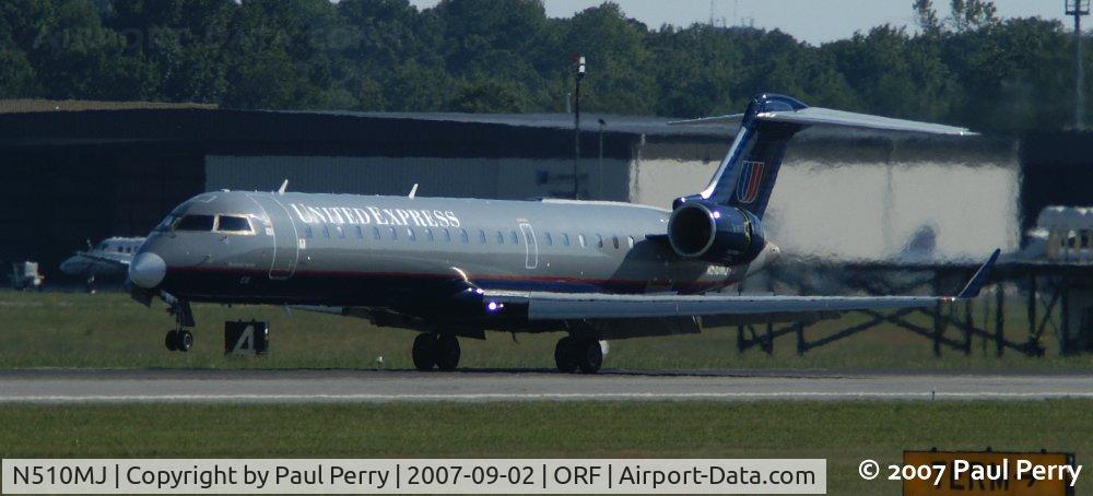 N510MJ, 2003 Bombardier CRJ-700 (CL-600-2C10) Regional Jet C/N 10101, Thrust diverters deployed, and nosewheel coming down