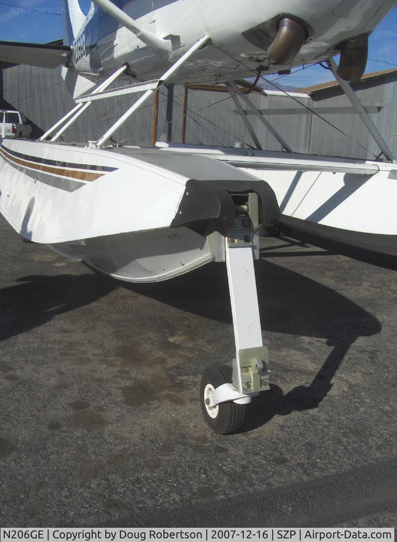 N206GE, 1994 Cessna U206G Stationair C/N U20606908, 1994 Cessna TU206G TURBO STATIONAIR Amphibian, Rolls Royce (USA) Allison 250-B17 420 shp turboprop conversion, Wipline amphibious floats. In retracted state, the aircraft tire serves as forward float bumper. Note large dual turbine exhausts.