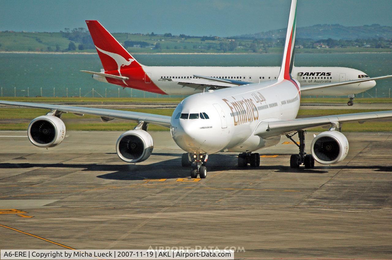 A6-ERE, 2004 Airbus A340-541 C/N 572, VH-OGJ in the background