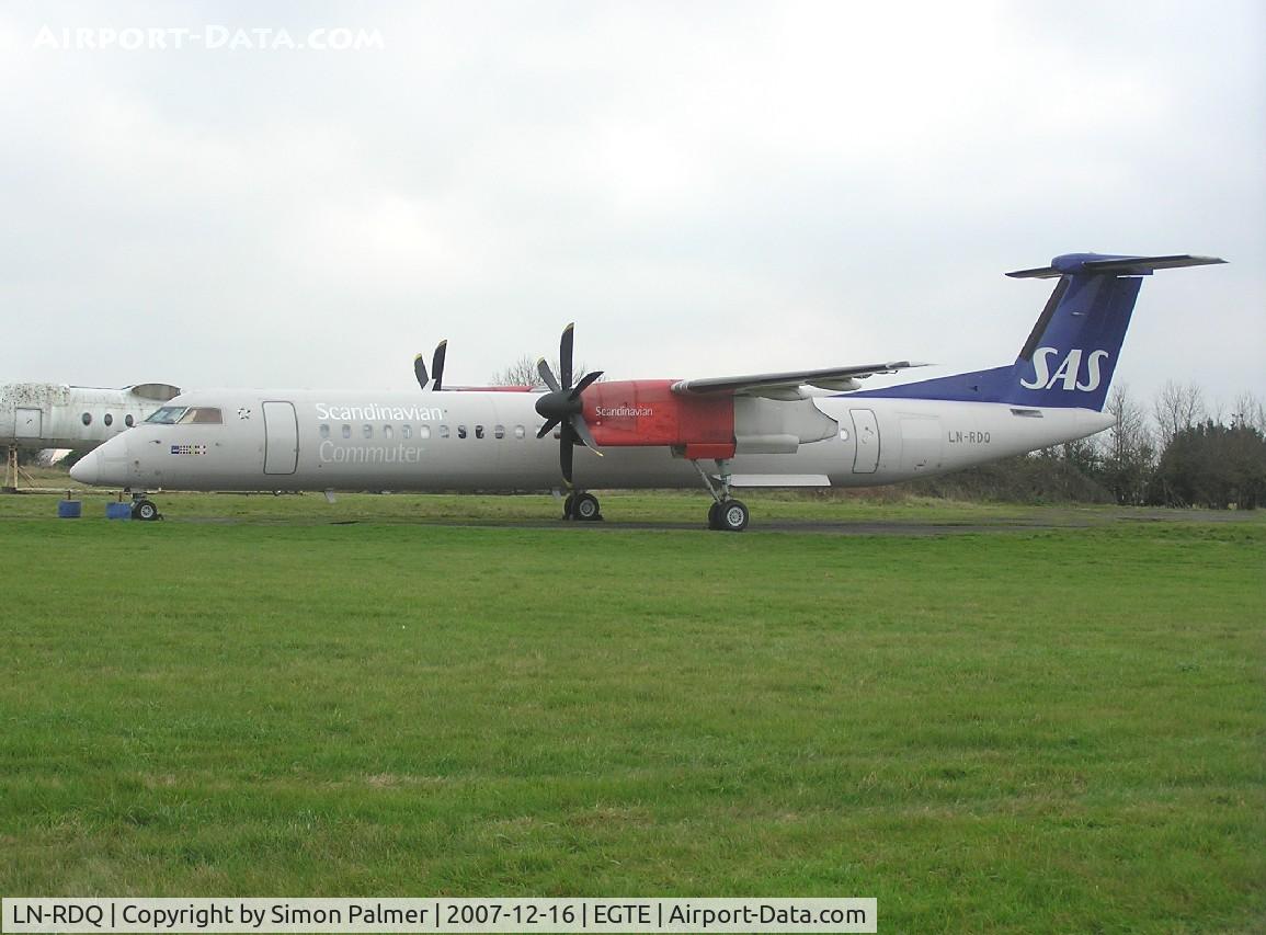 LN-RDQ, 1999 De Havilland Canada DHC-8-402Q Dash 8 C/N 4008, DHC-8-400 in the storage area at Exeter