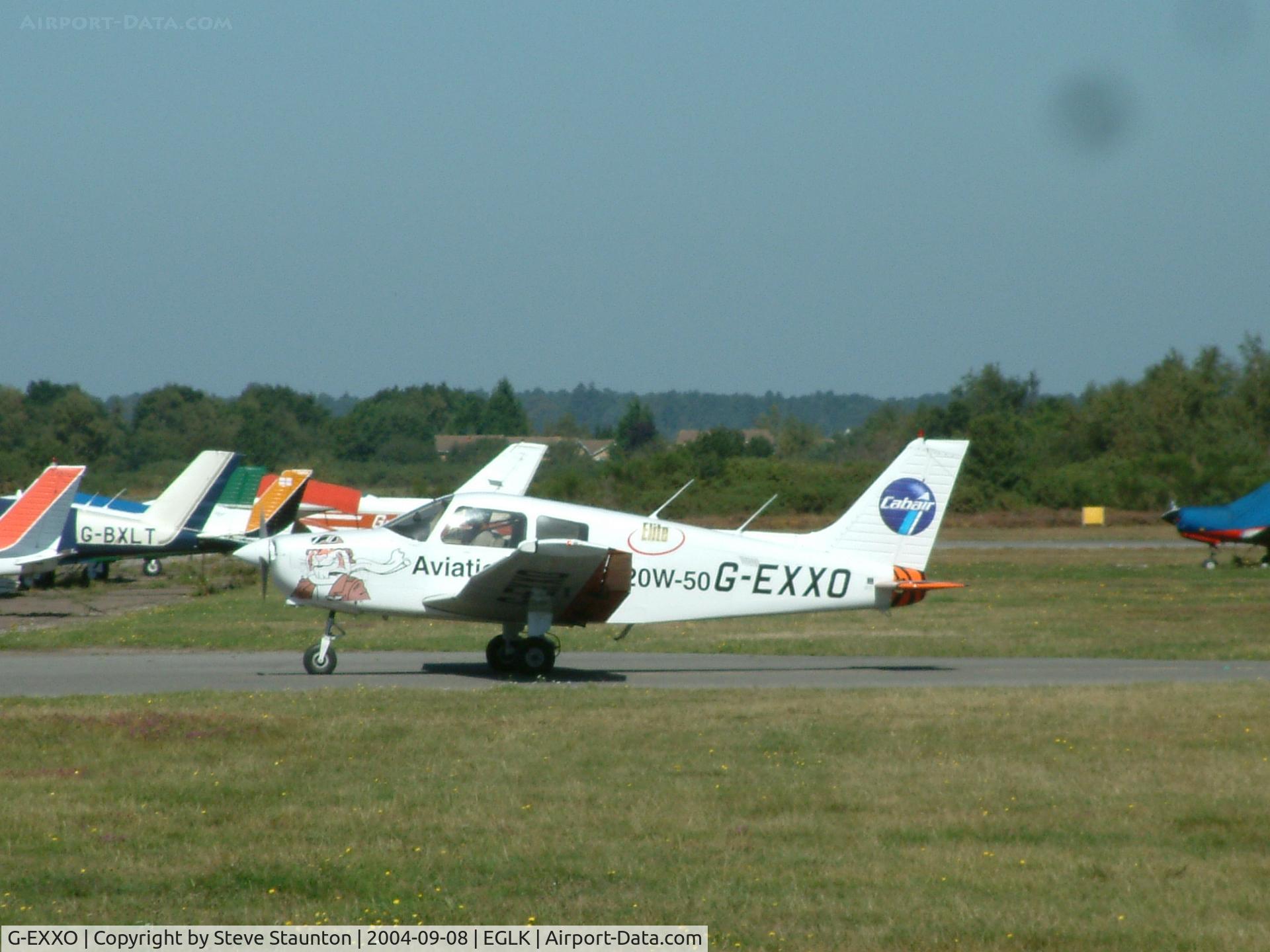 G-EXXO, 1989 Piper PA-28-161 Cadet C/N 2841210, Taken at Blackbushe Airport 8th September 2004 (sorry about the black spot on the lens)