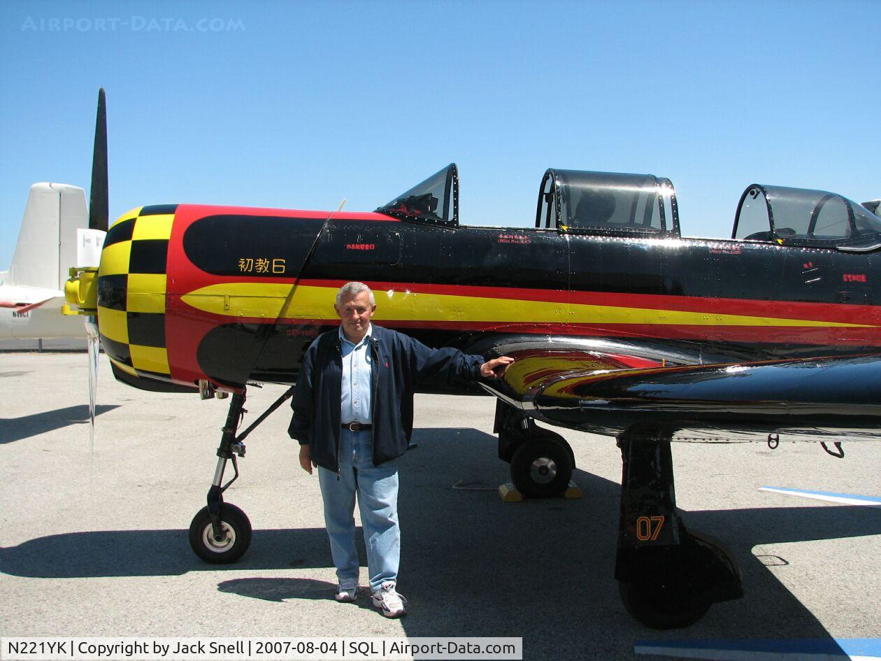 N221YK, 1968 Nanchang CJ-6 C/N 2432001, A Former Soviet Yak 18 pilot poses with the plane.