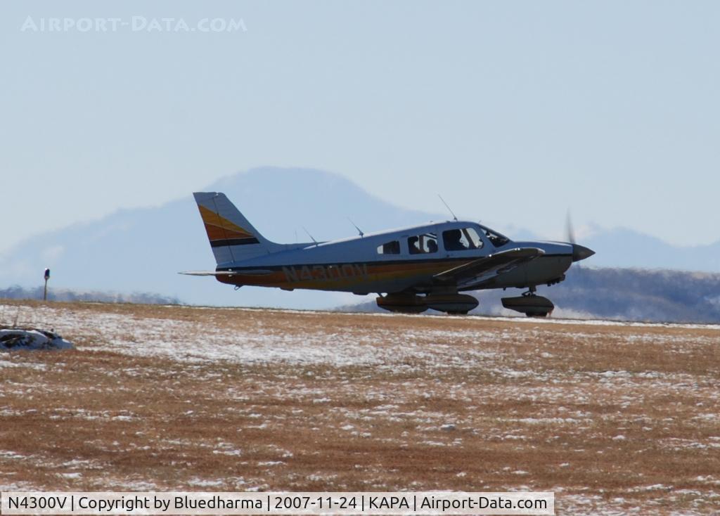 N4300V, Piper PA-28-236 Dakota C/N 28-8311016, Taxi to takeoff with Pikes Peak in the background.