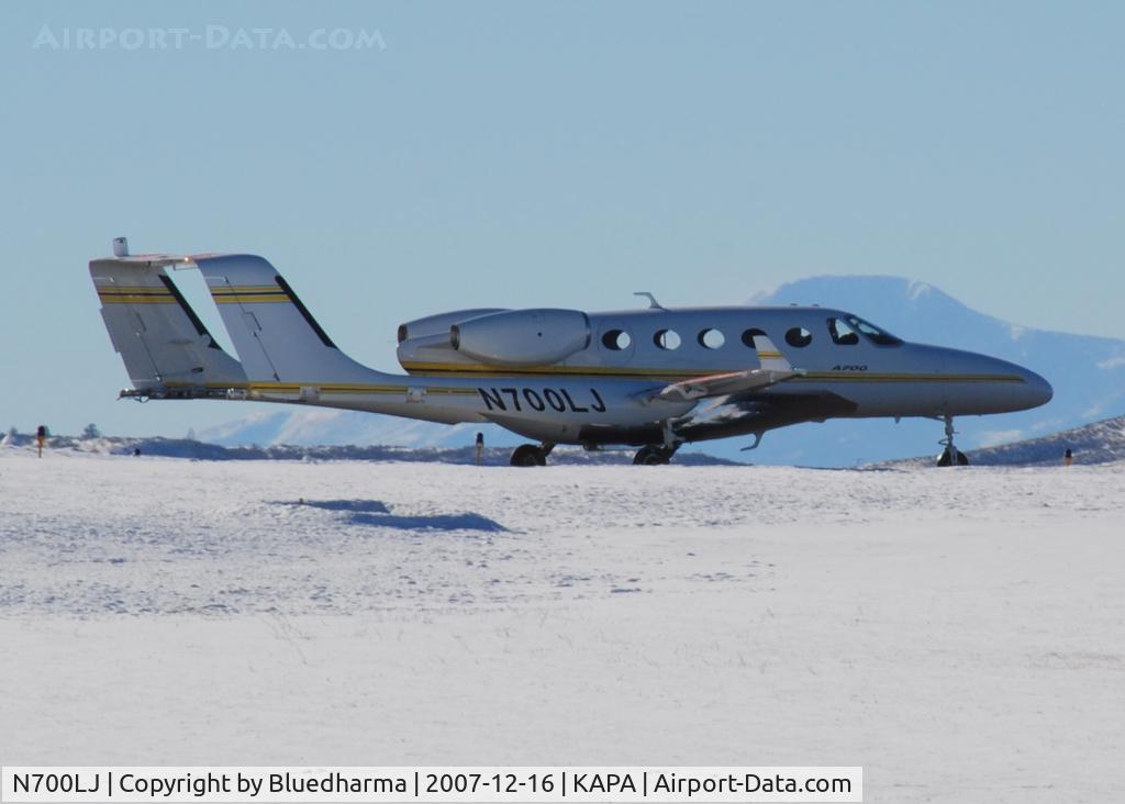 N700LJ, 2006 Adam Aircraft A700 C/N 0002, Taxi for takeoff on 17L, with Pikes Peak in the background.