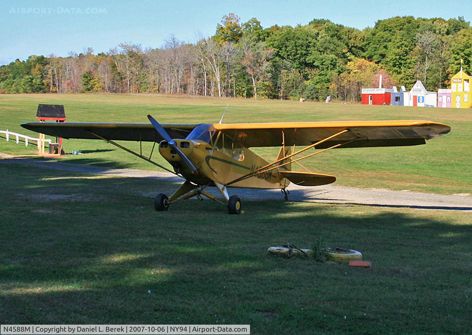 N4588M, 1947 Piper PA-11 Cub Special C/N 1191, A classic 1947 Cub takes five while the big boys perform their fly-bys.